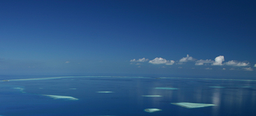 soft wind on a non-windy day, gentle waves in a calm sea